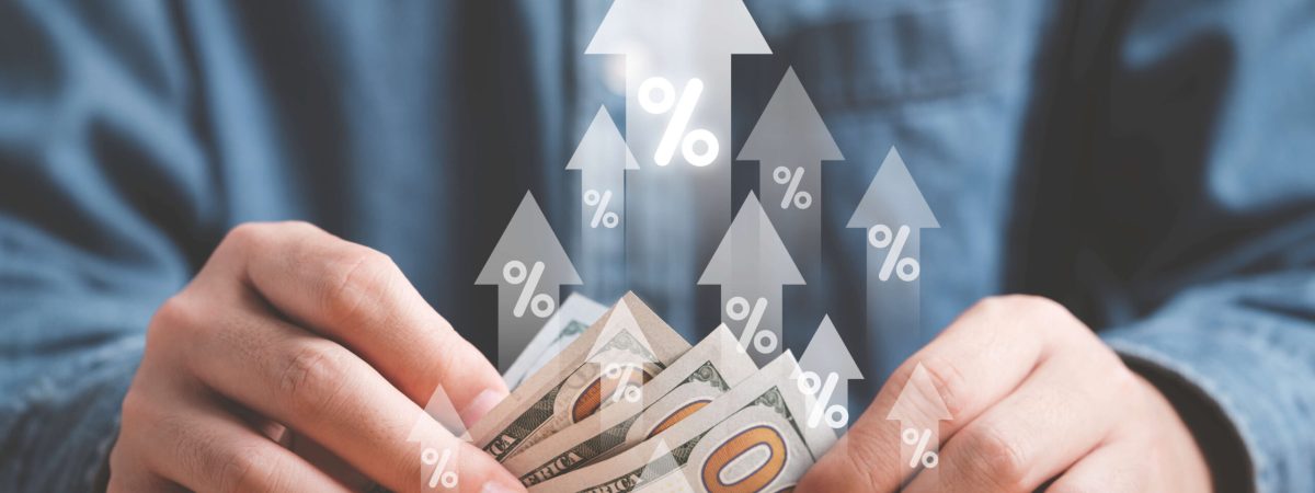 businessman-holding-counting-usd-dollar-banknote-with-up-arrow-percentage-sign-interest-rating-growth-tackle-with-inflation-increasing-concept